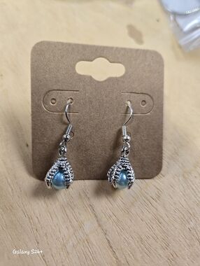 Handmade Dangle Talon Gripping Blueish Bead.